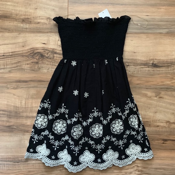 Rue21 Tops - Rue 21 Black Peplum Top W/ White Flowers